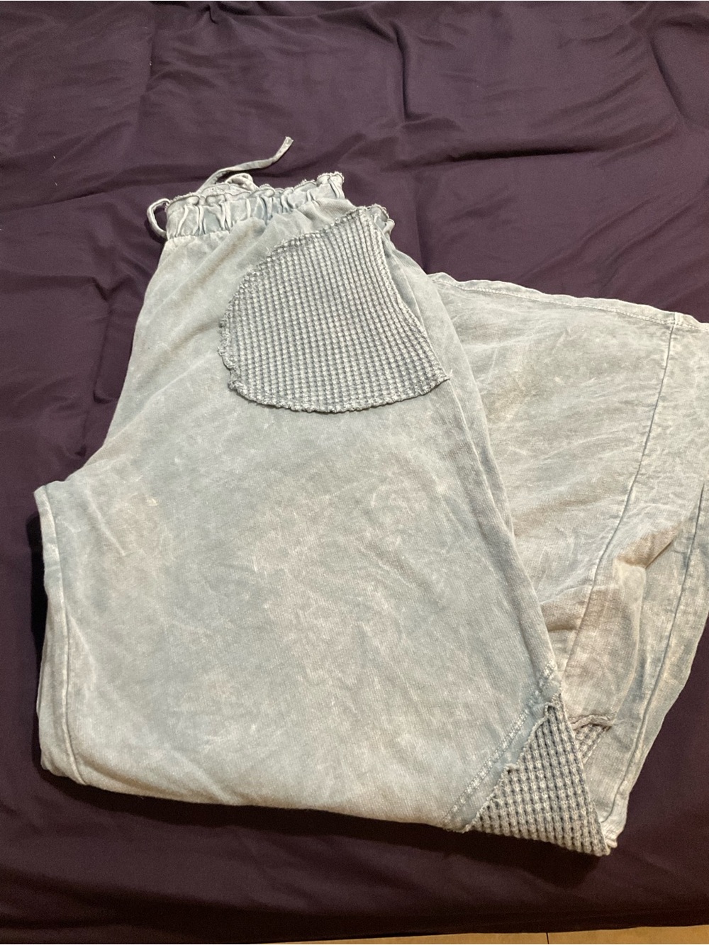 J. Her wide leg light gray pants
